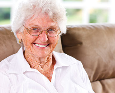 Photo of a smiling woman. Links to Gifts of Life Insurance