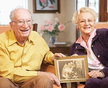 Photo of a smiling couple. Links to Gifts of Real Estate